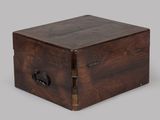 an old wooden box with a latch on the lid