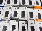 several boxes of cell phones are stacked on top of each other