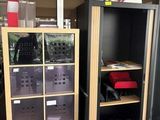 two shelves with bins on them in the corner of a room