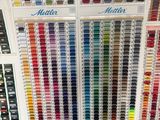 many different colors of paint on display in a store