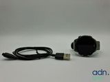 a close up of a smart watch connected to a usb cable