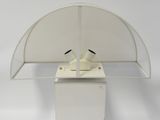 a white lamp that is on top of a white box