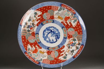 a red and blue plate with a design on it