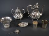 a lot of silver items that are on a table