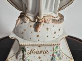 a statue of a woman holding a baby in her arms