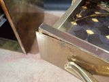 a close up of a drawer with a tie on it