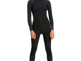 a woman in a black wetsuit standing on a white background