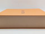 a close up of a box on a white surface with a white background