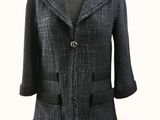 an image of a woman ' s jacket on a mannequin