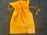 a small yellow bag with a logo on it sitting on a table