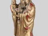 an image of a statue of a man holding a child