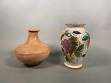 two vases sitting next to each other on a table