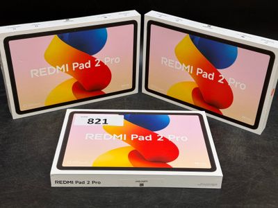 three new redmi pad 2 pro tablets are sitting in a box