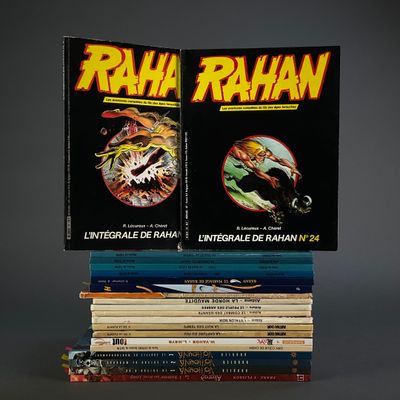 two books stacked on top of each other on a table
