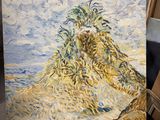 a picture of a painting on a easel in a room