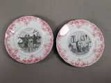 two pink and white plates with pictures of people on them