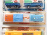 three different types of toy trucks in the package