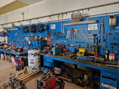 many tools on the workbench in this garage