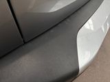 a close up of a car door handle with a sticker on it