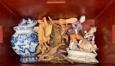 a red box with a bunch of figurines in it