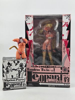a doll that is in a box next to a box