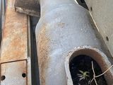 a large pipe that is attached to the side of a building