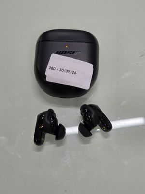 a pair of ear buds sitting on top of a table