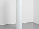 a lamp that is sitting on the floor next to a mouse
