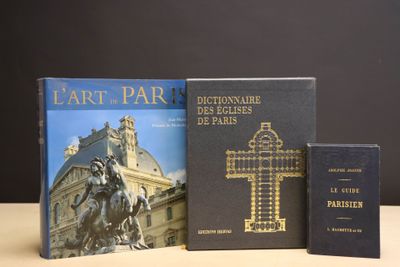 two books are sitting on a table next to a cross and a book