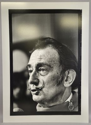 an old black and white photo of a man with a nose ring