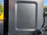 an image of a microwave oven sitting on the ground