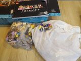 a box of legos sitting on a table next to a bag of legos