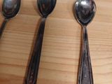 several spoons and spoon spoons on a wooden table