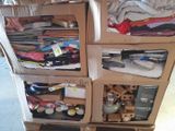 a cart with many boxes of clothes on top of it