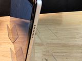 a tablet computer sitting on top of a wooden table