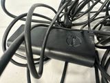 a lot of wires that are tangled up on the floor