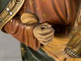 a statue of a woman holding a baby in her arms