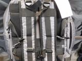 a suitcase that has a backpack inside of it