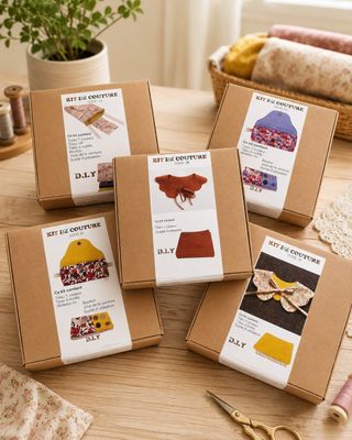 four boxes of craft kits sitting on top of a wooden table