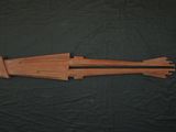 an image of a wooden arrow made out of wood on a black background