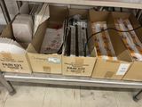 many boxes that are sitting on a metal shelf