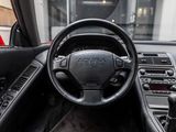 a steering wheel and dashboard of a car in a car showroom