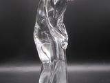 an image of a glass figurine of a man holding a golf club