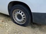 a white van parked on the side of the road