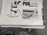 a picture of a manual for a sewing machine on a table