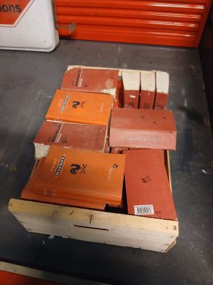 many books stacked on top of each other on a table