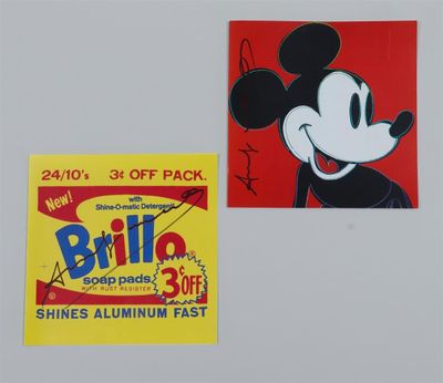 two mickey mouse stickers on a refrigerator door with a price tag