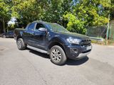 a black pickup truck parked on the side of the road