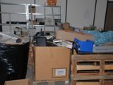 a pile of boxes and other items in a room