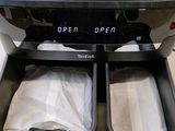 two open bins in the middle of a toaster